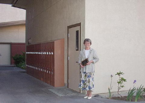 By the door of her classroom